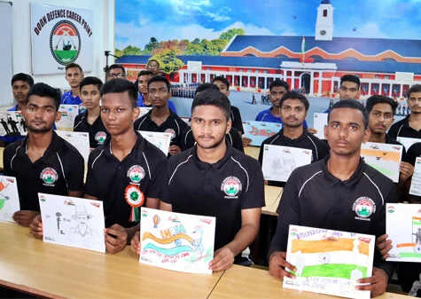DDCP Indian Army coaching students displaying national-theme drawings during a college activity in Dehradun