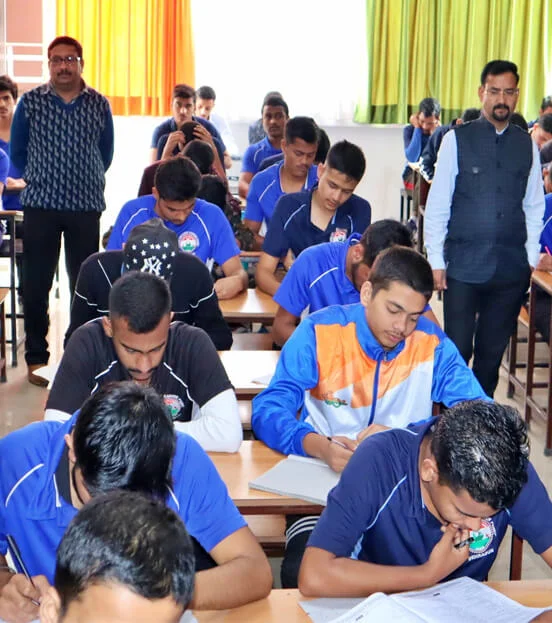 DDCP Indian Army coaching students writing a written exam under faculty supervision in Dehradun