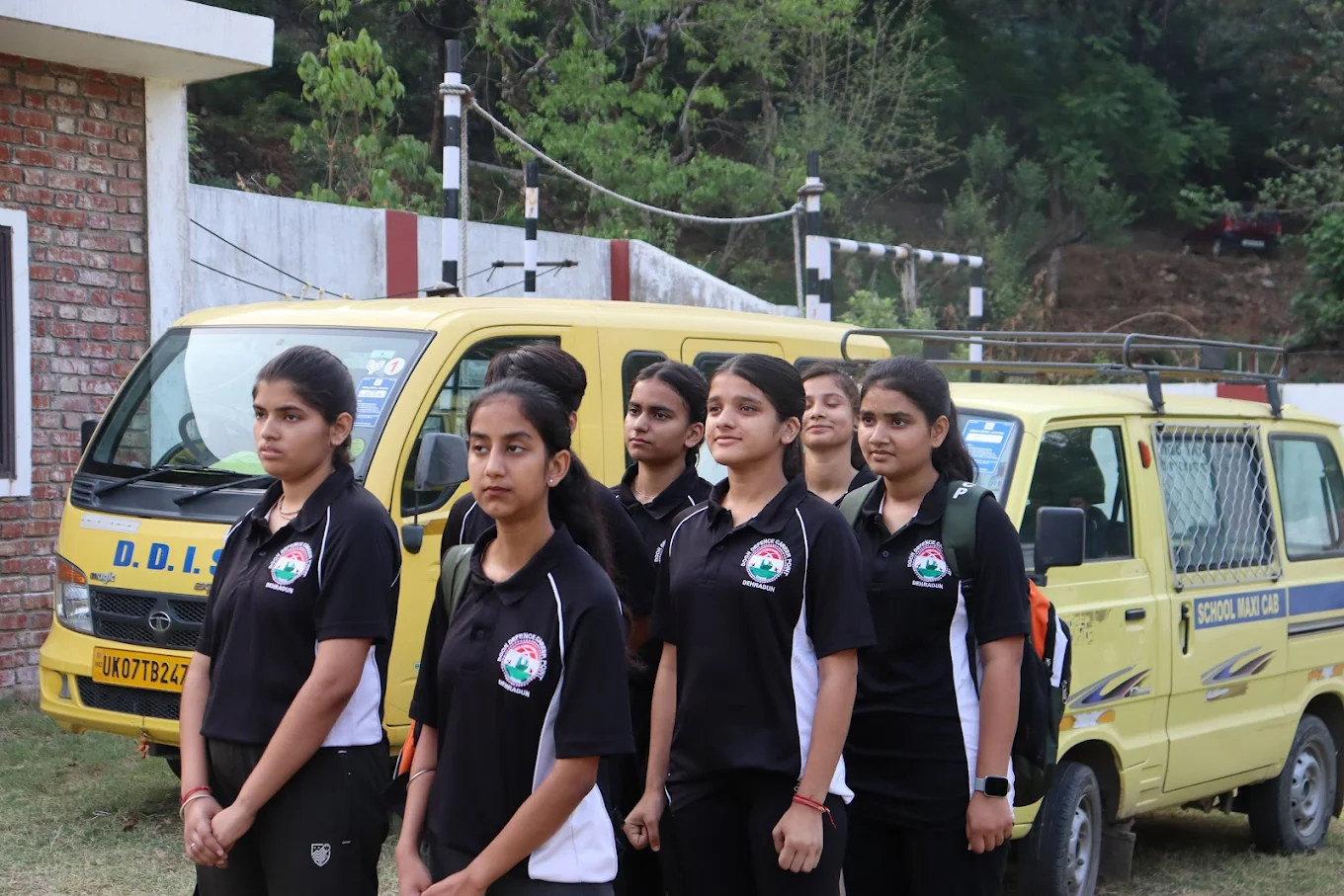 DDCP girl cadets in uniform outside the academy transport