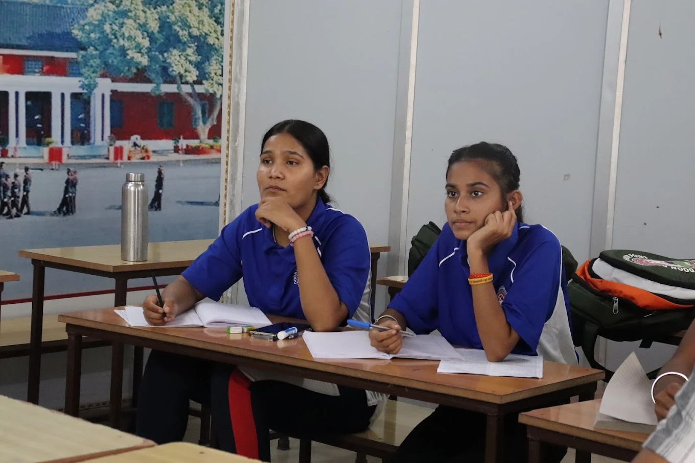 Girl students attending an NDA coaching classroom lecture at DDCP Dehradun